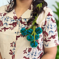 Peacock Blend Kerala Parandi hair accessory in teal blue and green for South Indian bridal wear
