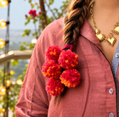 KANAV Sunset Blend Kerala Parandi hair accessory in warm orange and pink tones for bridal styling
